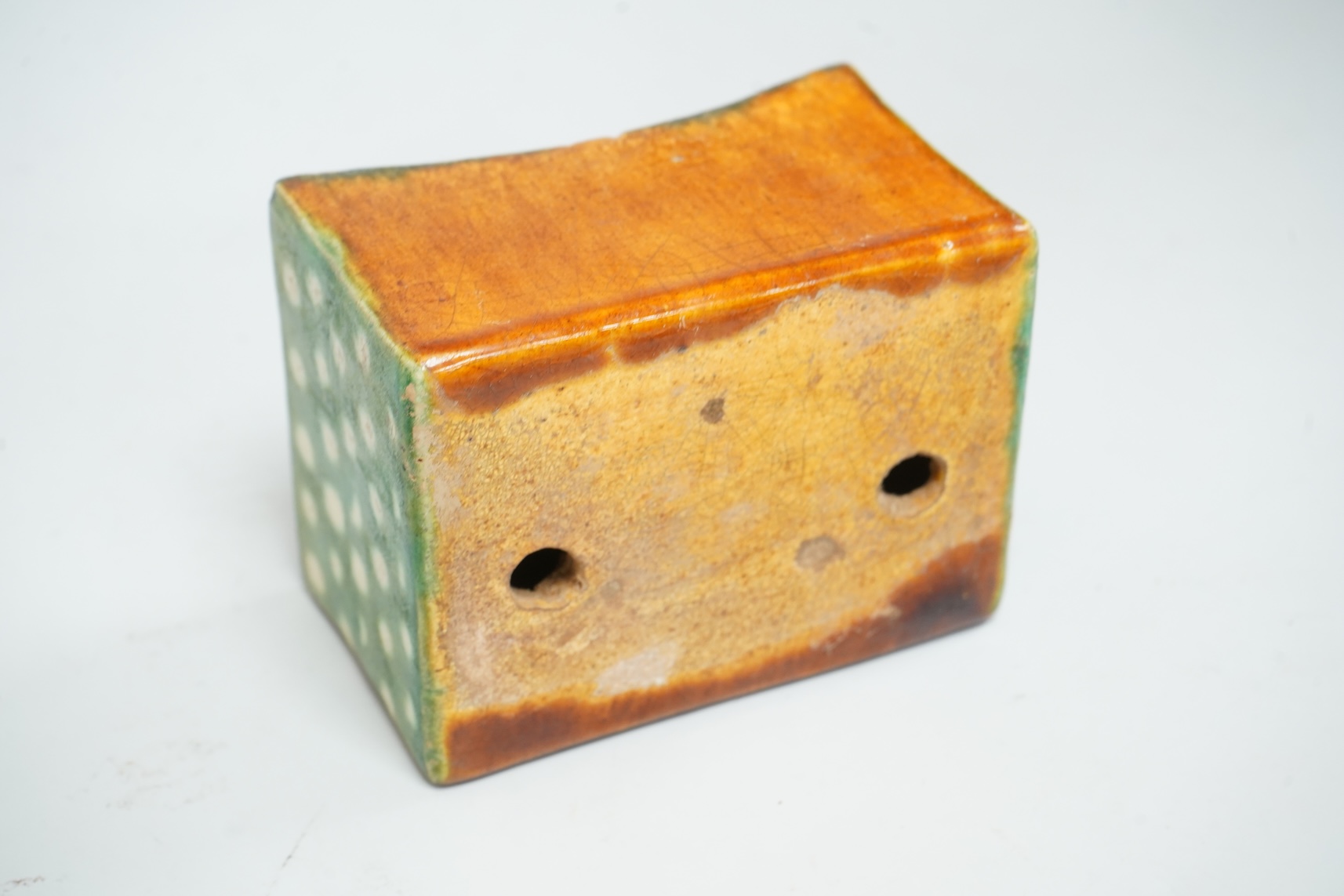 A Chinese stone ware arm rest, 10cm wide